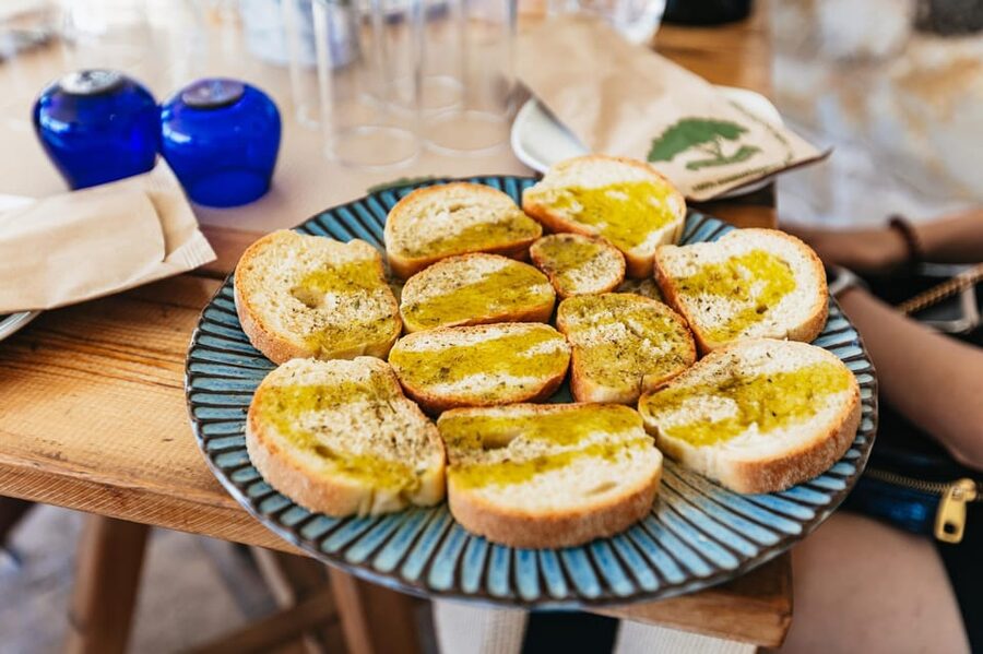 From Chania: Wine and Olive Oil Tasting Tour with Snacks - The ancient olive tree and a traditional village